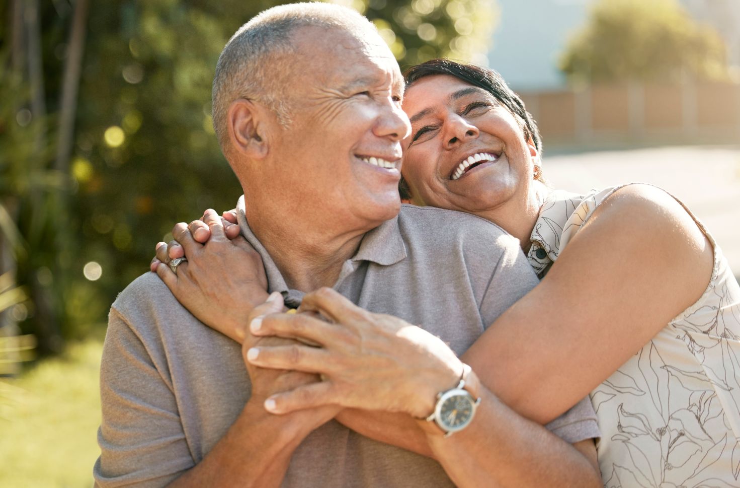 happy couple smiling after financing hearing aids.