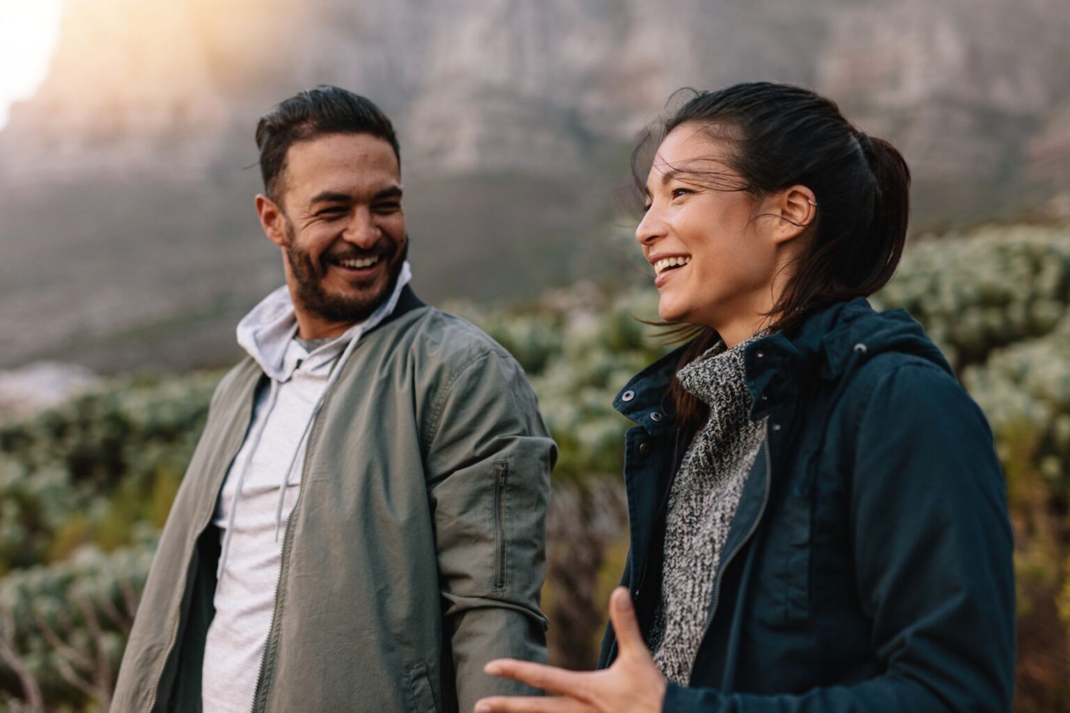 woman with aphasia talking with man on a hike